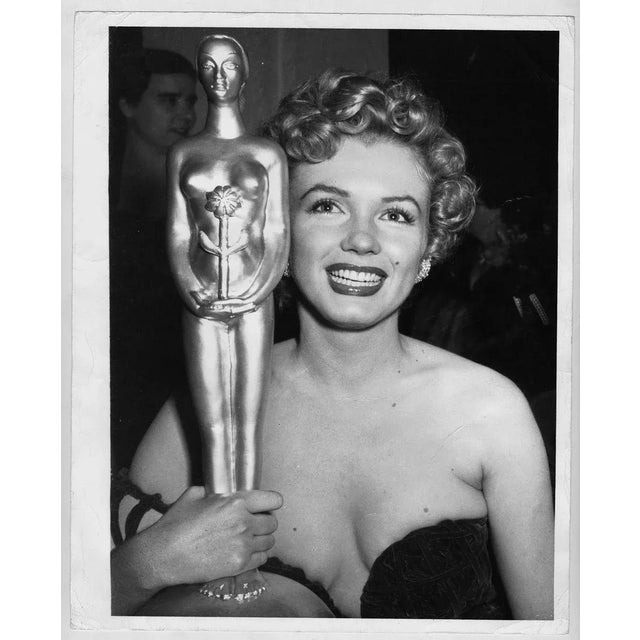 Actress Marilyn Monroe wins a trophy at the 'Star Of Tomorrow' Awards on January 26, 1952 in Los Angeles, California....