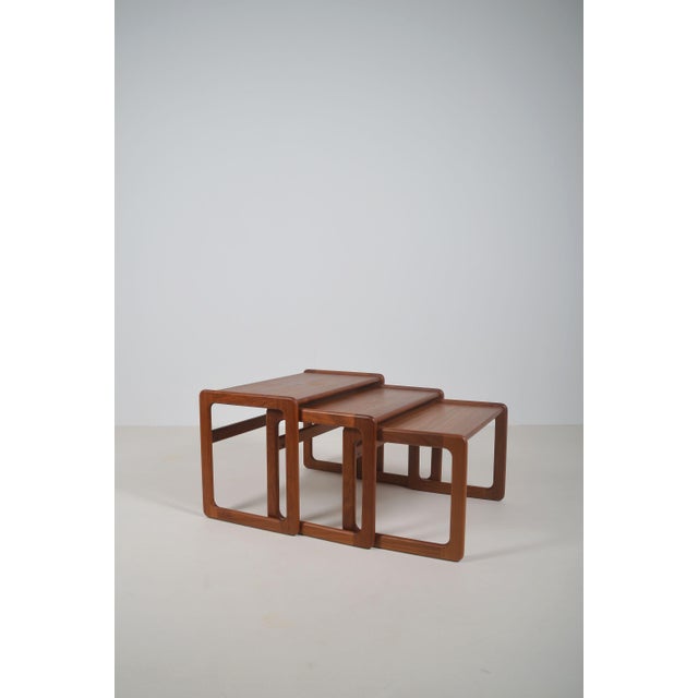 Set of 3 Danish nesting tables from the 1960s in teak wood. These tables are a beautiful combination of simplicity,...