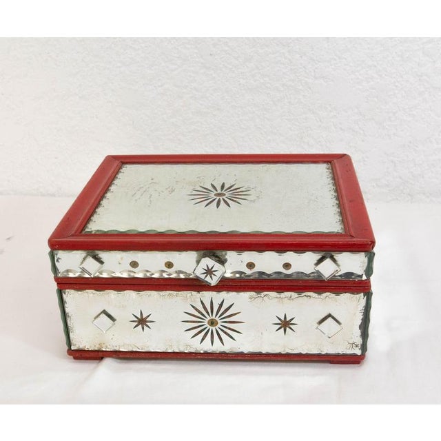 Jewelry box completely covered with beveled glass. A rose adorns the lid of the box. Good condition with marks of time and...
