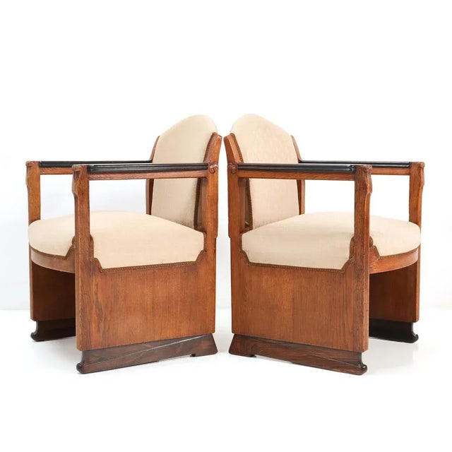 Magnificent and rare pair of Art Deco Amsterdamse School armchairs. The design is attributed to Hildo Krop for 't Woonhuys...