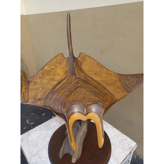 Vintage wooden Manta ray sculpture on wooden stand. Signed underneath