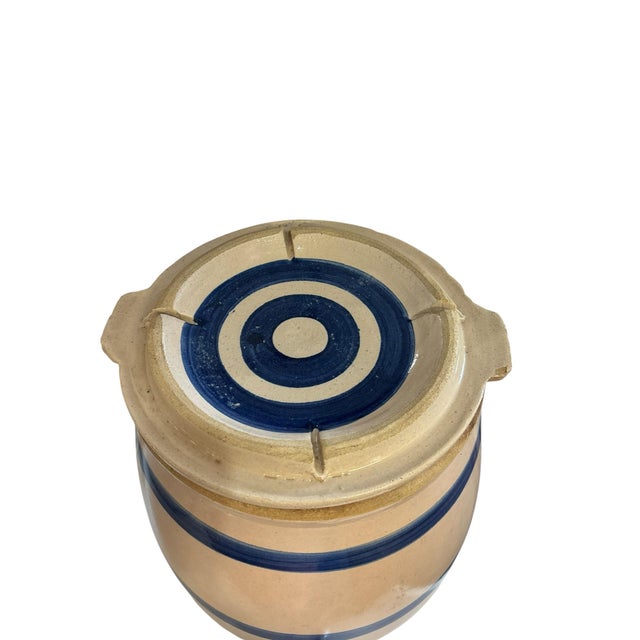 Classic Robinson Ransbottom stoneware water cooler featuring traditional blue band decoration and a two-gallon capacity....