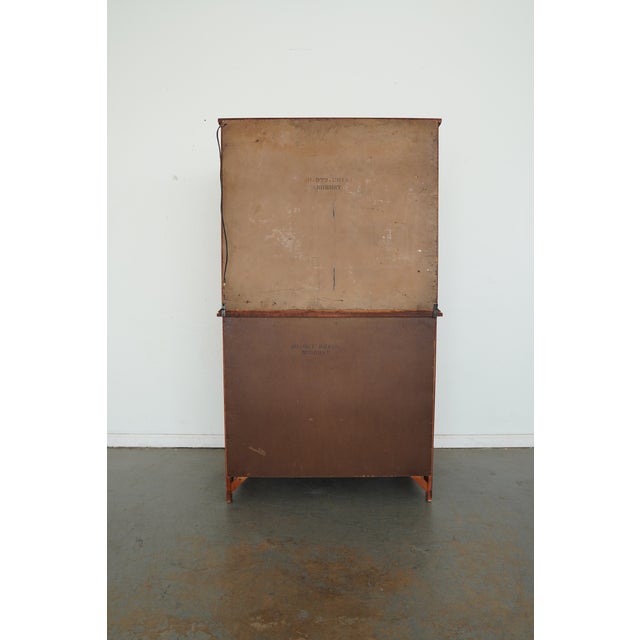 This vintage Traditional china cabinet features a classic two-piece hutch design with timeless, understated detailing. The...