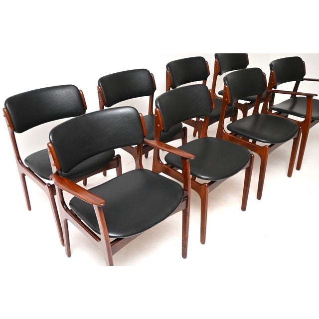 A superb set of eight Danish vintage dining chairs by Erik Buch. They were made in Denmark, they are the model 49 chair...
