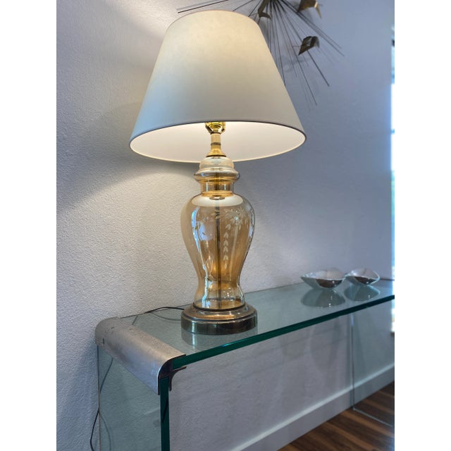 Vintage etched amber glass table lamp Brass base with beautiful translucent, iridescent amber glass with etched floral...