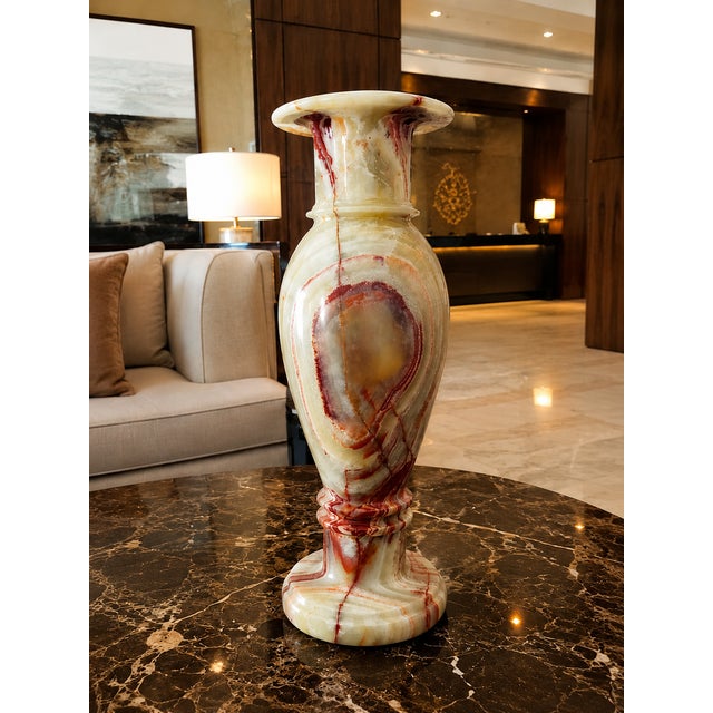 Bring timeless elegance to your home with this handcrafted natural onyx marble floor vase, expertly carved from a single...