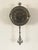 This timepiece is a Hotel Pasquier Wall Clock, a decorative battery-operated clock often associated with the Monticello...