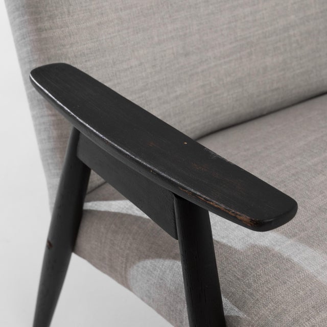 Enhance your home with this stylish pair of 1960s Czech Upholstered Armchairs. These mid-century modern pieces feature...