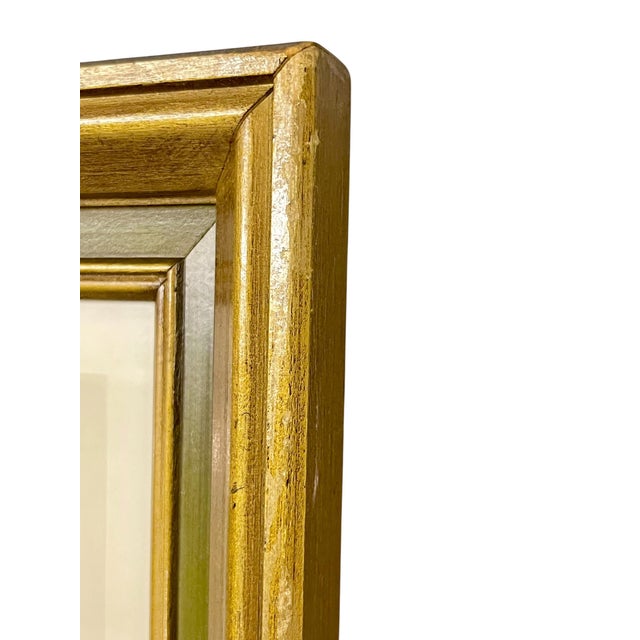 Elegant architectural view of Notre Dame de Paris, presented in a beautifully aged giltwood frame with layered molding and...