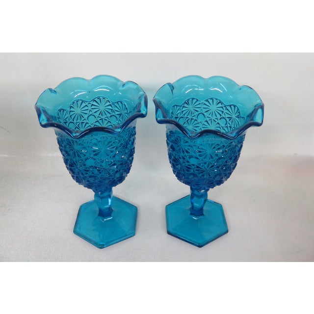 This stunning set of Two Compote Cups is made of glass. We believe the set was made by L.E. Smith due to its design,...