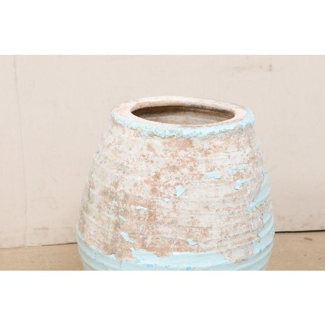 A Spanish clay jar with glazing from the 19th century. This antique terracotta vessel from Spain has a beautifully bulbous...