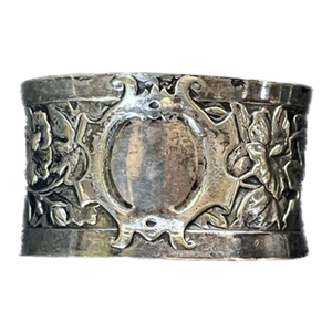 An Christofle Floral & Shield Napkin Ring