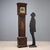 FRANCIS ROBINSON oak pendulum clock, finely lacquered and painted. The dial is in perforated and chiseled metal and...