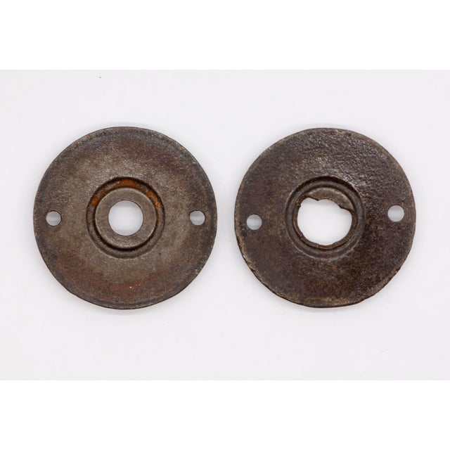 Ornate Aesthetic style black cast iron door rosettes with a black patina. There is minor damage on the back of one. Please...