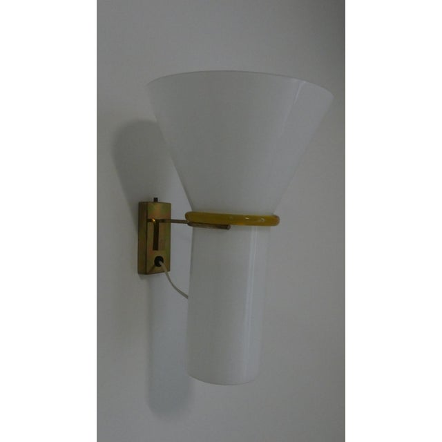 Wall lamps produced in Murano around the late 1960s or early 1970s. Iconic pieces of Venetian design, featuring a...