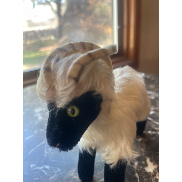 Vintage Ram Sheep Stuffed Animal with stripped horns, green eyes, face and legs in black, red thread for the mouth, hairy...