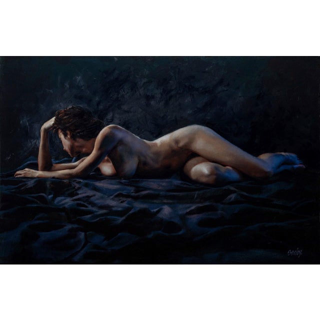 This oil painting captures a reclining figure, draped in shadows and soft light, emphasizing the graceful contours of the...