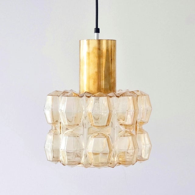 Large mid-century pendant by Helena Tynell for Limburg (Germany, 1960s). The amber/champagne colored hand blown bubble...