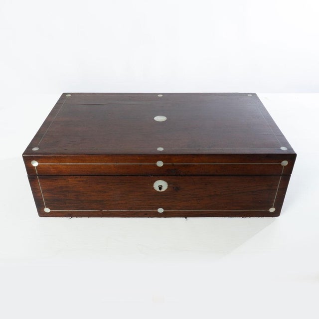 19th century rosewood with mother of pearl inlay. Great decor for an office or bedroom. Is still functional if desired....