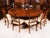 This is a wonderful quality 20th-century example of Robert Jupe's flame mahogany circular extending dining table. It was...