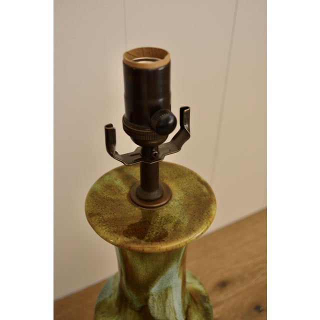 Great mid century studio pottery lamp in an organic modern glaze of greens, blues, and browns. With new bronze hardware,...