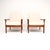 A stylish and extremely comfortable pair of Danish vintage teak armchairs by Sven Ellekaer. This model is called the...