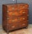 A handsome British military officer’s Campaign Ware chest of drawers or dresser, from the 19th century, featuring a...