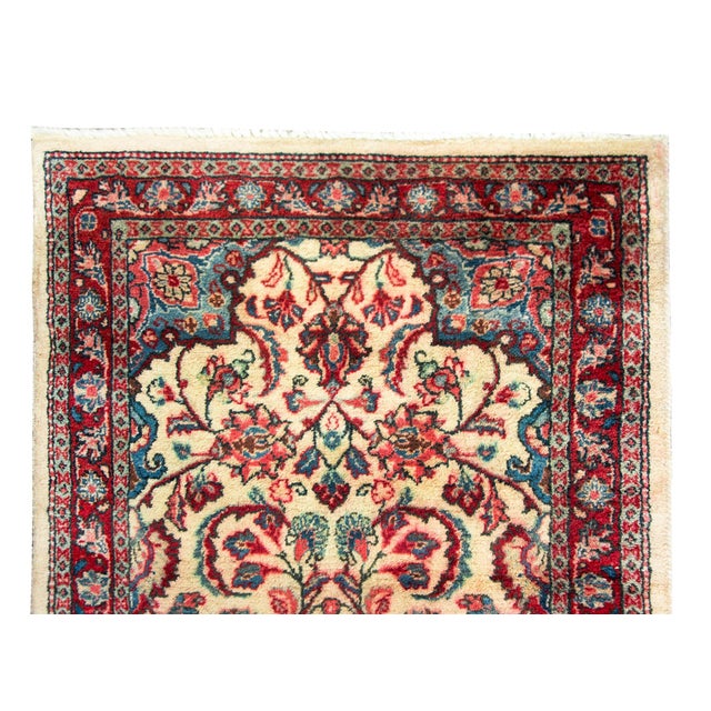 A wonderful mid-20th century Persian Tabriz runner with a large diamond medallion woven with flowers and vines emanating...