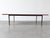 This vintage Scandinavian-design coffee table stands out for its warm, minimalist aesthetic based on contrasting...