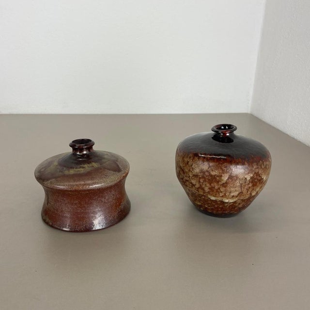 Article: Ceramic vases set of 2 Producer: Elmar & Elke Kubicek , Germany Decade: 1970s This original vintage Studio...