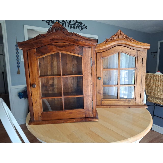 For sale is an exceptional, authentic matching pair of turn-of-the-century French provincial hanging wall cabinets, dating...