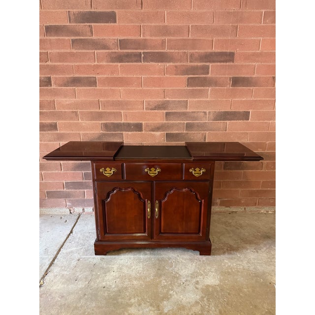 Vintage Drexel Heritage server with a classic Ralph Lauren New York townhouse aesthetic. Rich mahogany-toned wood, paneled...