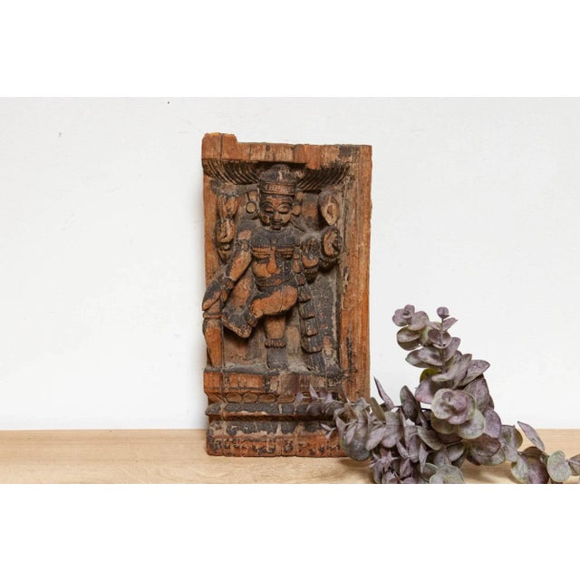 This enigmatic hand-carved figure embodies the allure of the Apsara, celestial dancers revered in Indian and Southeast...