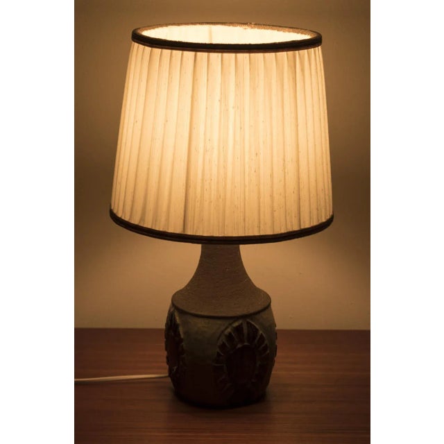 Wonderful table lamp designed by chris haslev for jeti, 1960s denmark. The lamp has a beautifully shaped ceramic base. The...