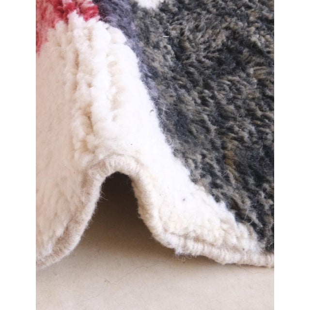 Modern Moroccan Rug | Handwoven Berber Wool Rug with Ivory Field and Bold Abstract Black and Red Shapes This striking...