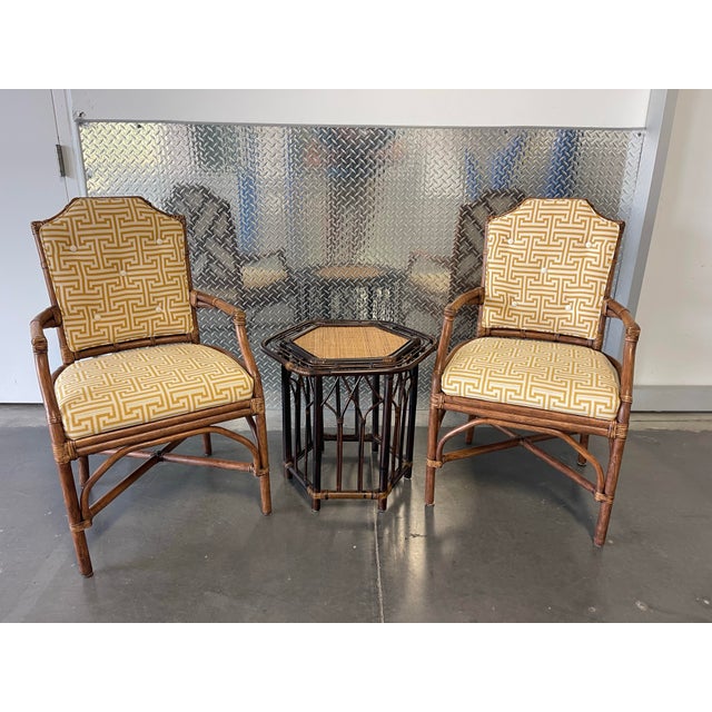 A sculptural vintage hexagonal side table crafted in organic rattan with a woven inset top. This piece features layered...