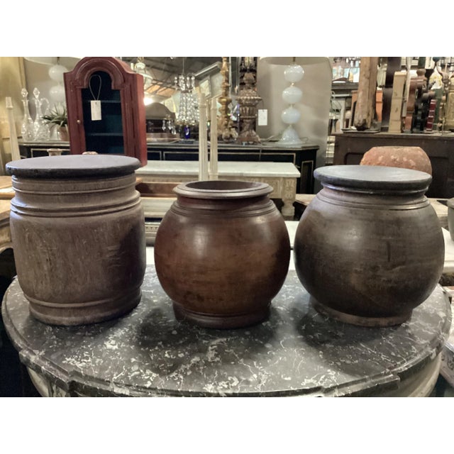 A hand carved storage container with unattached lid from India from the early to mid 20th C. This hand carved wooden...