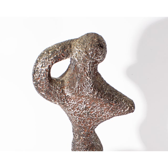 A 1972 sculpture of a nude figure produced by Austin Productions. This sculpture is an abstract form of a nude woman,...