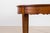 An exceptional and authentic Biedermeier dining table dating from the early 19th century, crafted from beautifully figured...