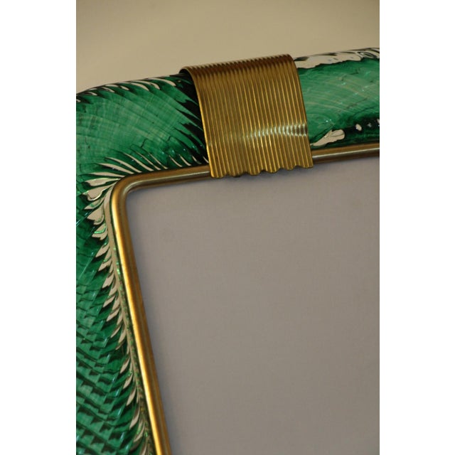 This beautiful vertical photo frame is purely in the vénitien glass manufacturing tradition.The technique uses to get this...