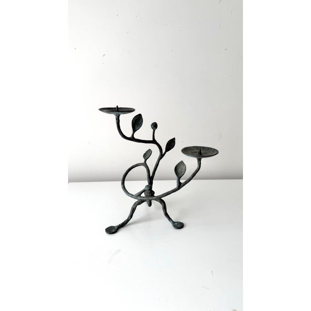 Vintage sculptural verdigris iron vine designed candlestick holder. The piece has a lovely look from all angles as the...