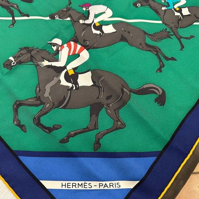 This is a vintage 1980s Hermès silk carré scarf titled Les Courses, which translates to The Races. It features a dynamic...