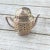 Fantastically fun midcentury sterling silver tea strainer in the shape of a teapot. This beauty is sure to catch the...