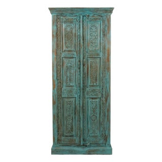 Antique Blue Hand-Carved Armoire | Floral Carved Cabinet With Brass Stud Accents For Sale