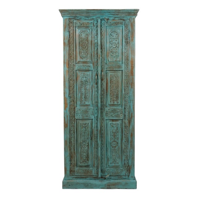 Antique Blue Hand-Carved Armoire | Floral Carved Cabinet With Brass Stud Accents For Sale