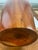 A hand turned tall cylindrical wooden vase probably walnut not marked