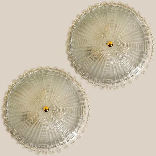 Two large mid-20th century flushmounts by Peill & Putzler. Made around 1970 in Germany, Europe. Featuring a large glass...