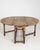This drop-leaf gateleg table makes its impression through dark walnut, oval top. The piece dates to 19th Century, sourced...