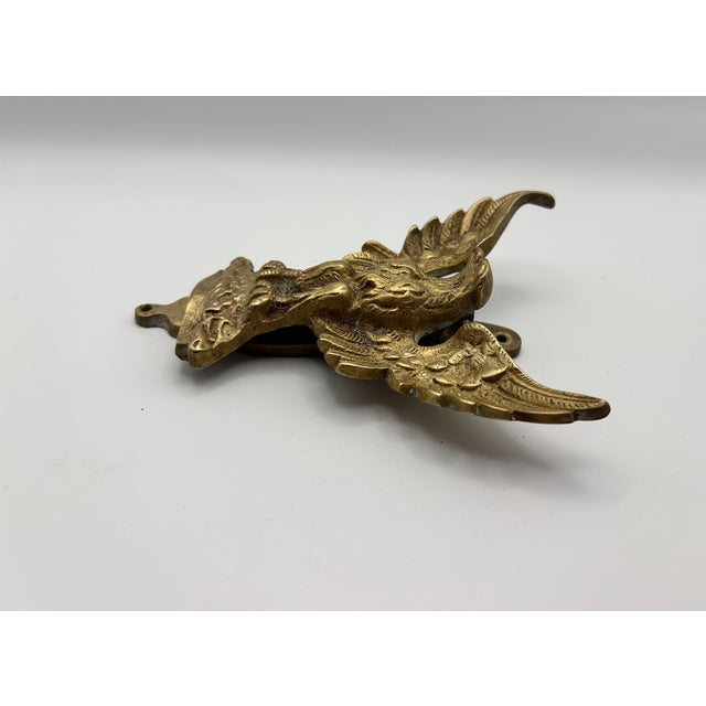 From England, a solid brass eagle door knocker. Mounting screws not included.