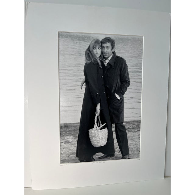 Collectible black and white photograph by Jean d'Hugues of Jane Birkin and Serge Gainsbourg. Bords de Seine, 1969....